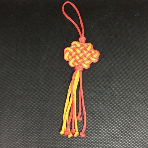 Infinity knot suspension orange